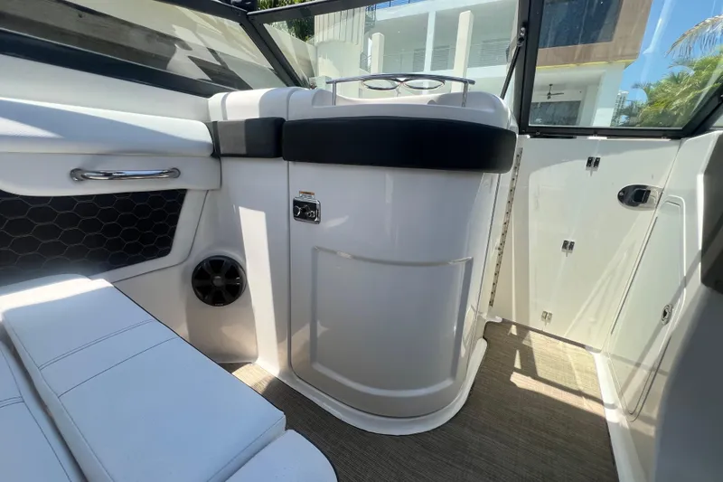 Slide: The Image of 2019 Sea Ray SDX 270 Outboard interior with sleek seating and modern design elements. - 77