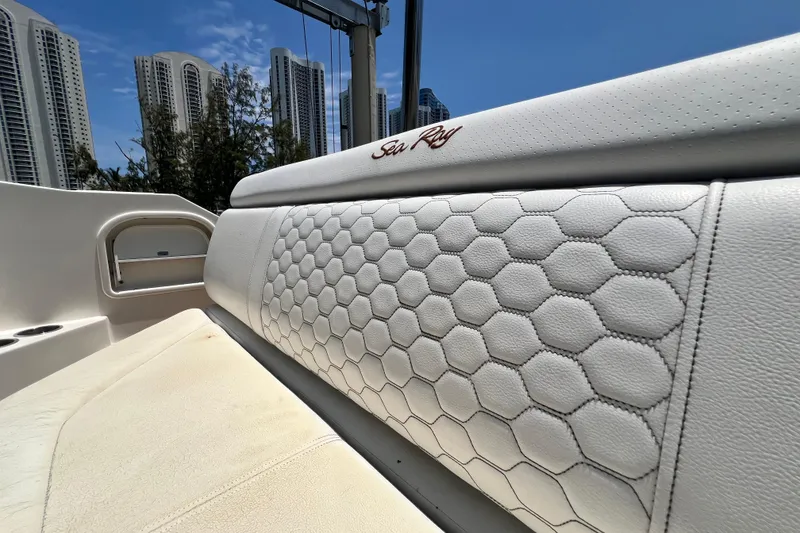 Slide: The Image of 2019 Sea Ray SDX 270 Outboard boat seat with hexagonal pattern, city skyline background. - 40