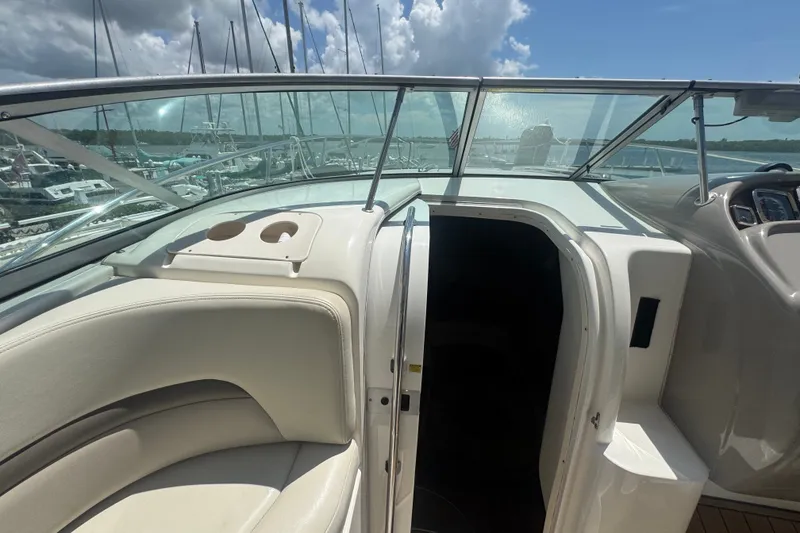 Slide: The Image of 2008 Chaparral Signature 290 boat interior with seating and cabin entrance. - 20