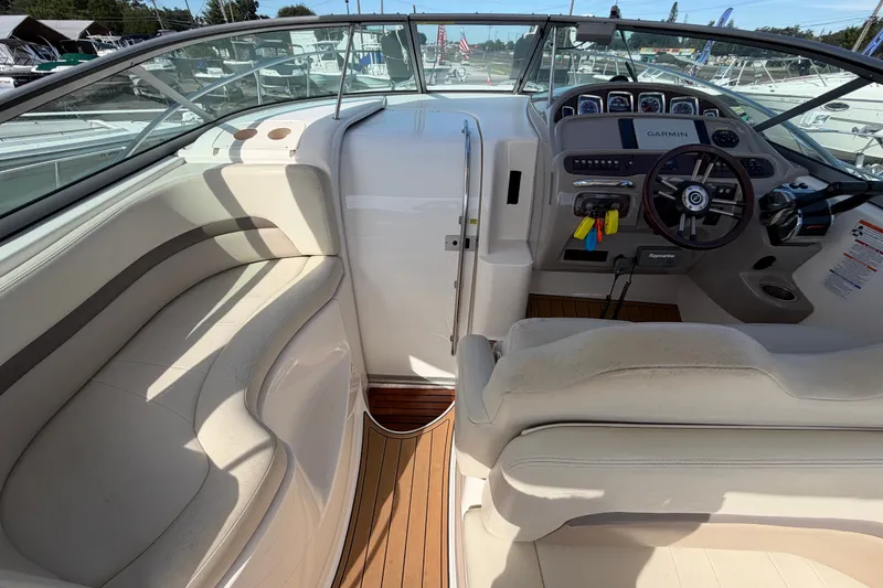 Slide: The Image of 2008 Chaparral Signature 290 boat interior with helm, seating, and Garmin navigation system. - 14