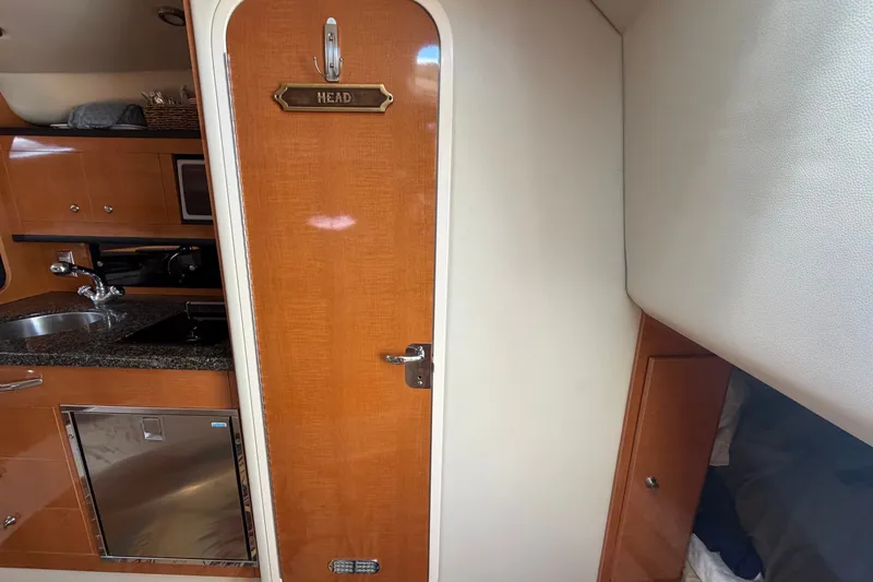 Slide: The Image of Interior of 2008 Chaparral Signature 290 yacht with kitchenette and head door. - 83