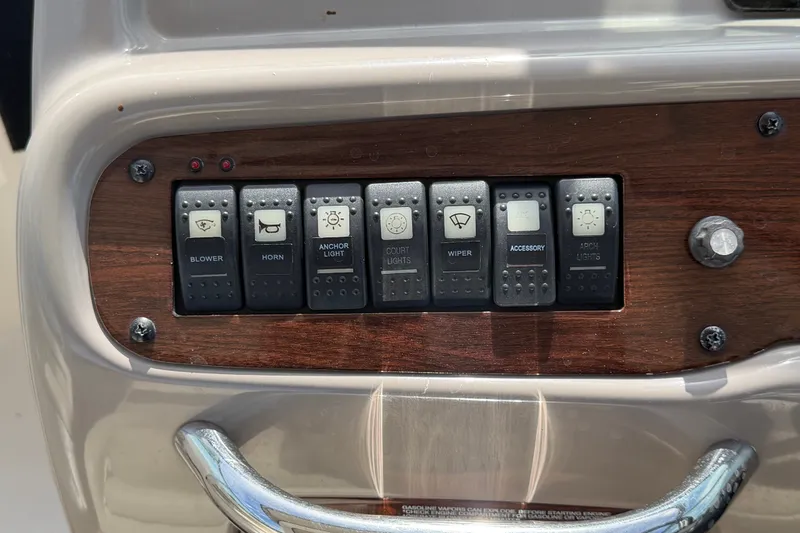 Slide: The Image of Control panel of a 2008 Chaparral Signature 290 boat with various switches. - 35