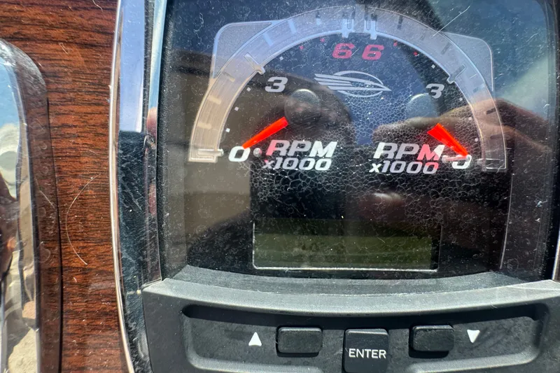 Slide: The Image of Dashboard of a 2008 Chaparral Signature 290 showing RPM gauges. - 55
