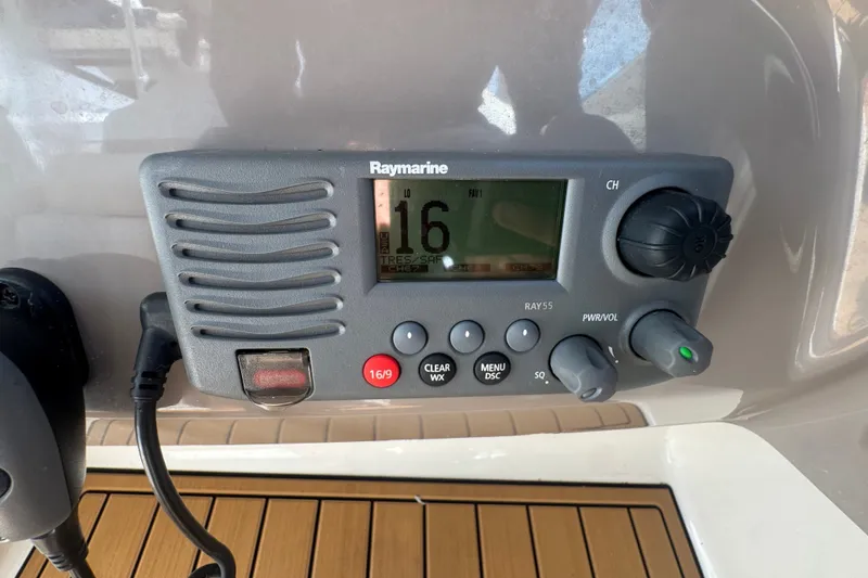 Slide: The Image of Raymarine radio on 2008 Chaparral Signature 290 boat dashboard. - 61