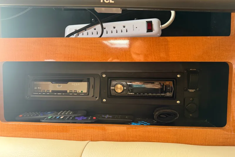 Slide: The Image of Entertainment system in 2008 Chaparral Signature 290 boat with DVD player and stereo. - 51