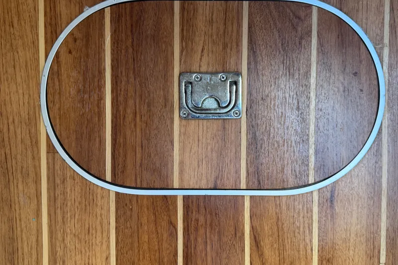 Slide: The Image of Wooden deck hatch with metal handle on 2008 Chaparral Signature 290 boat. - 90