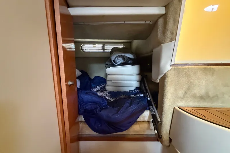 Slide: The Image of 2008 Chaparral Signature 290 cabin interior with bedding and cushions. - 92
