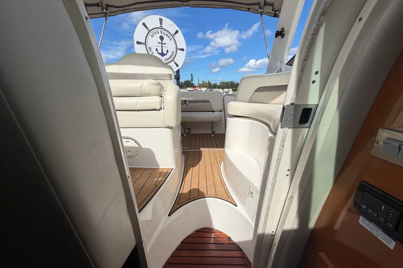 Slide: The Image of Interior view of 2008 Chaparral Signature 290 boat with seating and wooden flooring. - 97