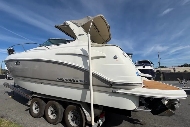 Slide: The Image of 2008 Chaparral Signature 290 boat on trailer, side view under clear sky. - 1