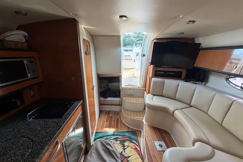 Slide: The Image of Interior of 2008 Chaparral Signature 290 yacht with modern amenities and cozy seating. - 28