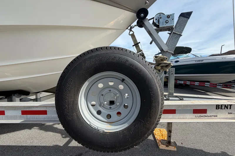 Slide: The Image of Trailer tire supporting a 2008 Chaparral Signature 290 boat on a Loadmaster trailer. - 123