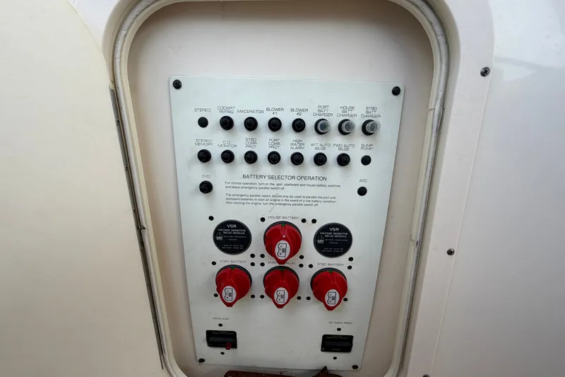Slide: The Image of Control panel of a 2008 Chaparral Signature 290 boat, featuring battery selector switches. - 115