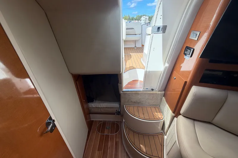 Slide: The Image of Interior view of 2008 Chaparral Signature 290 boat, featuring wood flooring and seating. - 88