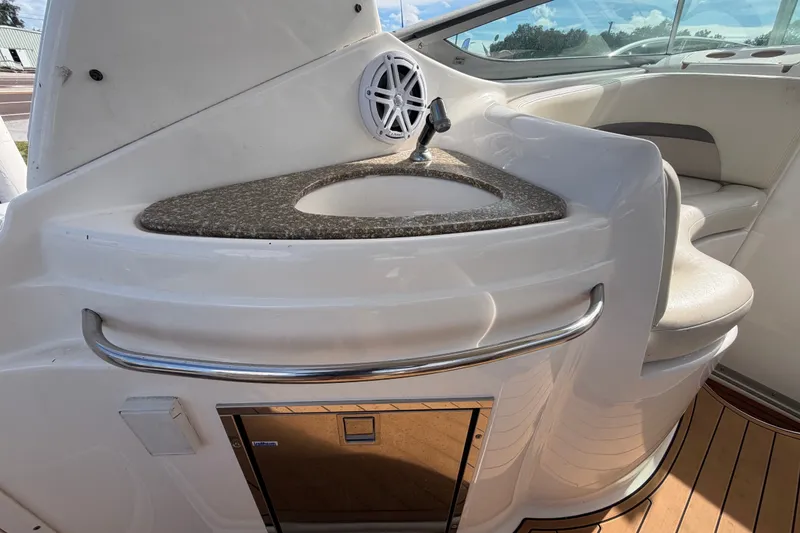 Slide: The Image of 2008 Chaparral Signature 290 boat interior with sink and seating area. - 20