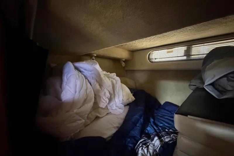 Slide: The Image of Cozy cabin interior of 2008 Chaparral Signature 290 with bedding and window. - 95