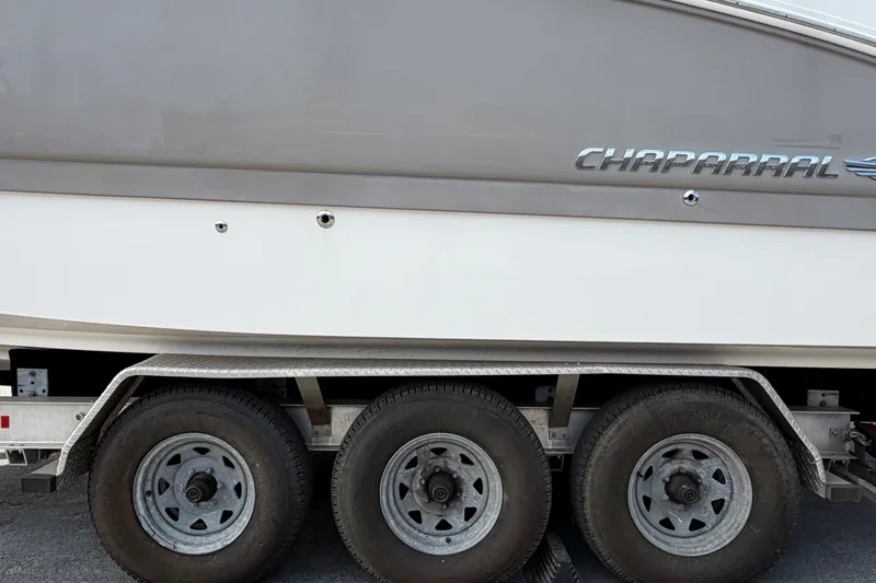 Slide: The Image of 2008 Chaparral Signature 290 boat on a triple-axle trailer, side view. - 125