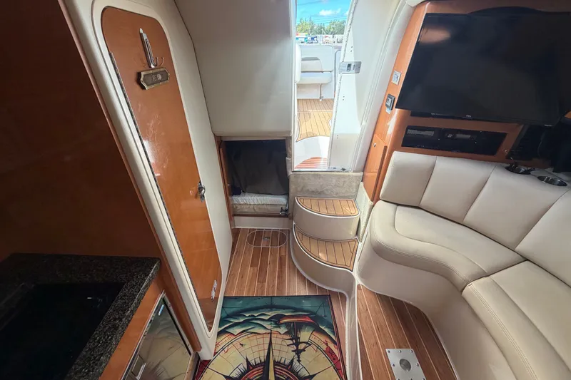 Slide: The Image of Interior of 2008 Chaparral Signature 290 boat with elegant seating and wooden flooring. - 81