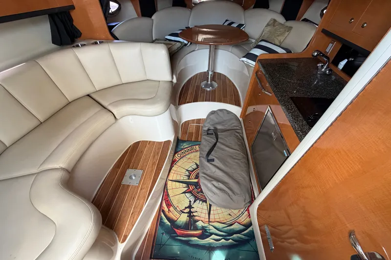 Slide: The Image of Luxurious interior of 2008 Chaparral Signature 290 yacht with seating and kitchenette. - 23