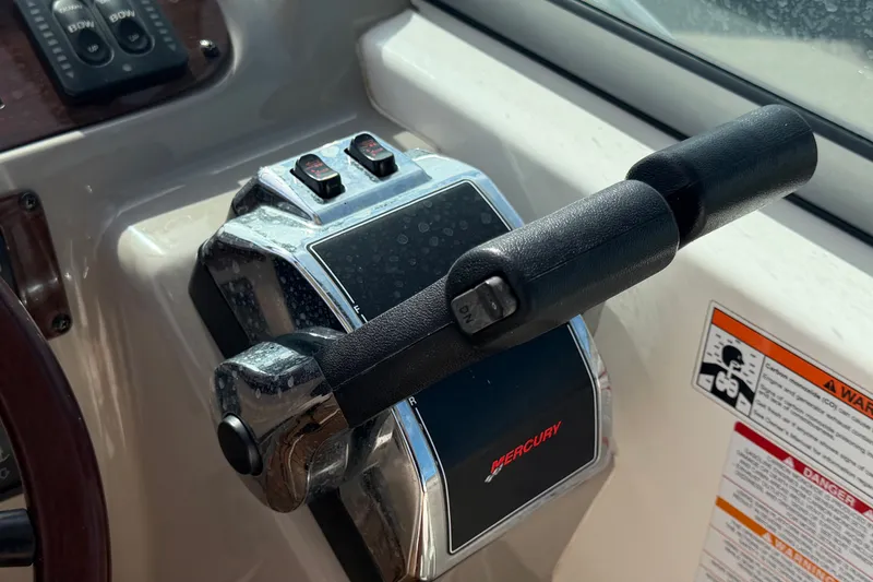 Slide: The Image of Throttle control of a 2008 Chaparral Signature 290 boat with Mercury branding. - 39
