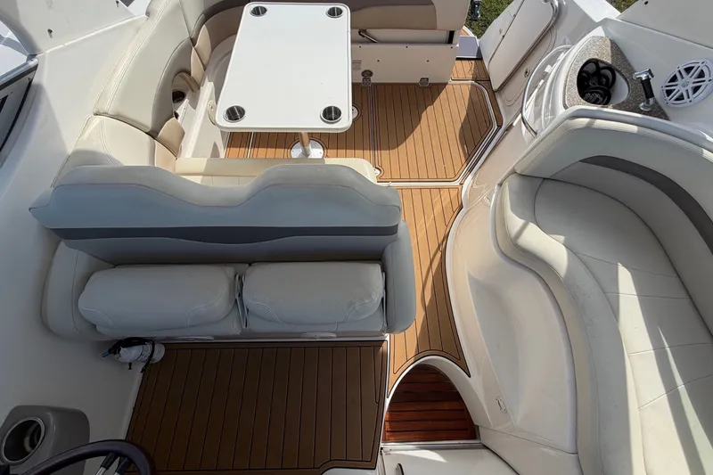 Slide: The Image of The image shows the cockpit of a 2008 Chaparral Signature 290 with elegant seating and wood flooring. - 34