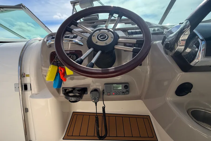 Slide: The Image of Steering wheel and controls of 2008 Chaparral Signature 290 boat cockpit. - 40