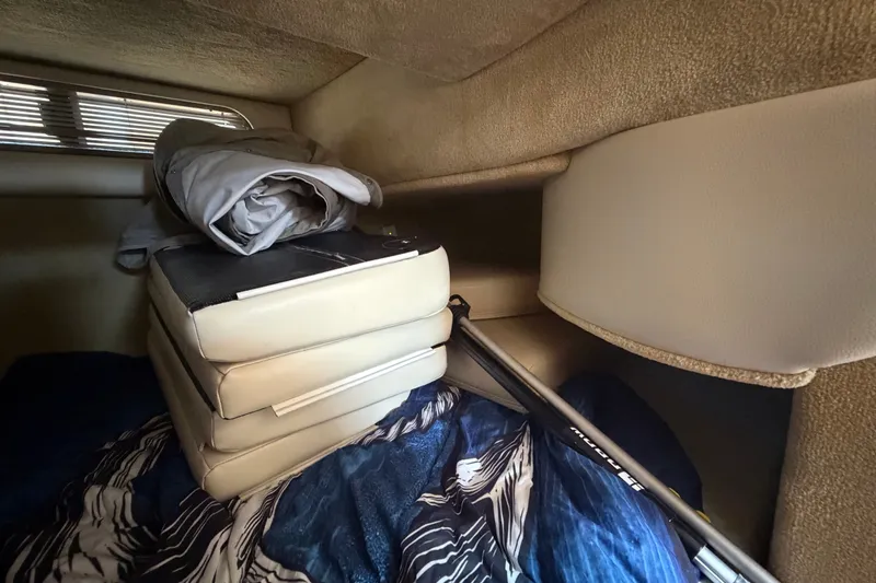 Slide: The Image of Interior cabin of 2008 Chaparral Signature 290 with stacked cushions and bedding. - 96