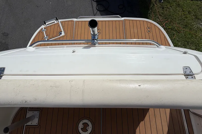 Slide: The Image of 2008 Chaparral Signature 290 boat deck with wood finish and metal railing. - 37