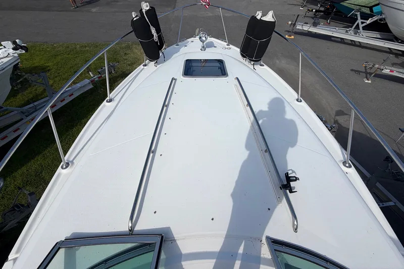 Slide: The Image of The image shows the foredeck of a 2008 Chaparral Signature 290 with stainless steel railings. - 30