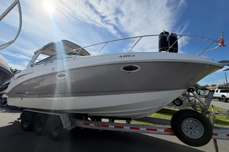 Slide: The Image of 2008 Chaparral Signature 290 boat on trailer under sunny sky. - 7