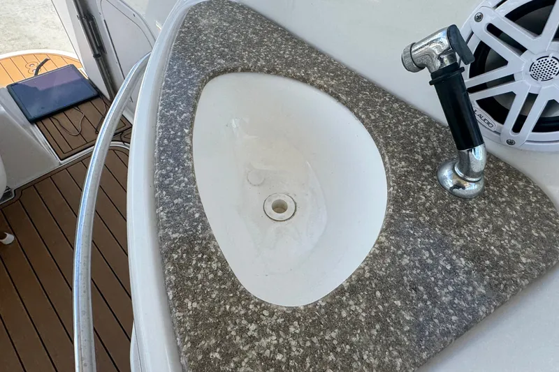 Slide: The Image of 2008 Chaparral Signature 290 boat sink with faucet and speaker. - 53