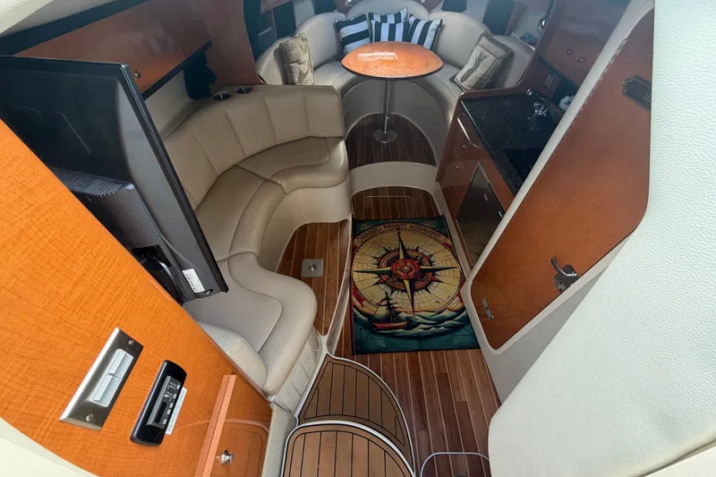 Slide: The Image of Interior of 2008 Chaparral Signature 290 boat with cozy seating and nautical decor. - 44