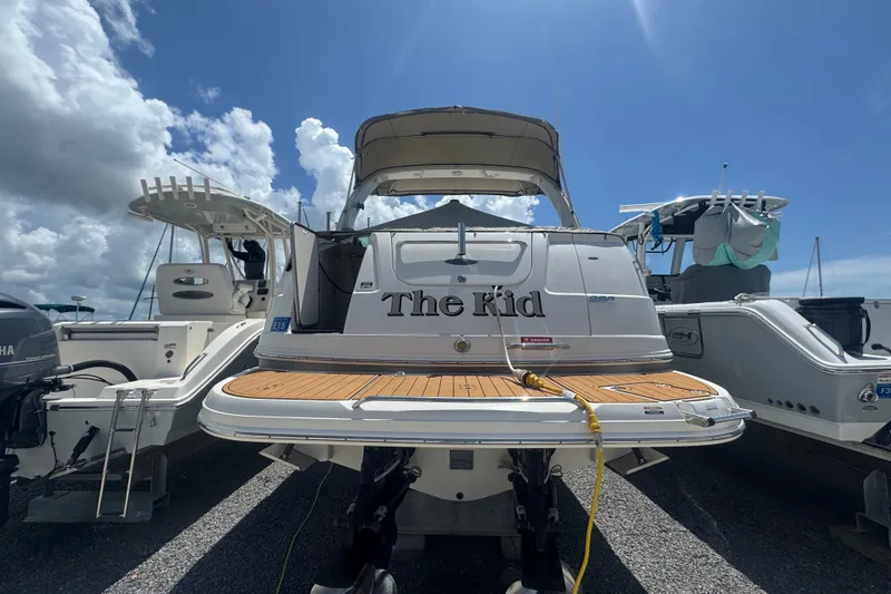 Slide: The Image of 2008 Chaparral Signature 290 boat docked under a clear blue sky. - 2