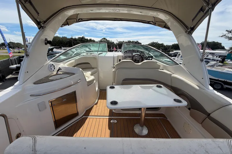 Slide: The Image of 2008 Chaparral Signature 290 boat interior with seating and table, showcasing luxury design. - 17
