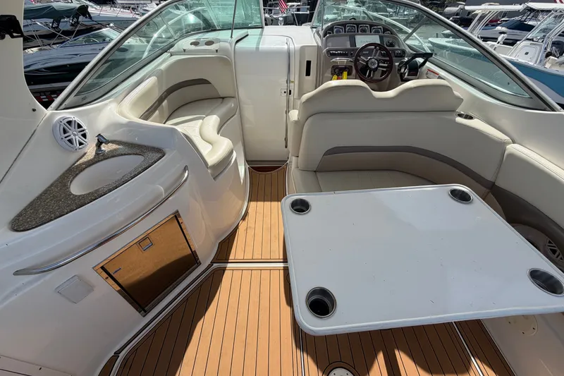 Slide: The Image of 2008 Chaparral Signature 290 boat interior with seating, table, and helm. - 22
