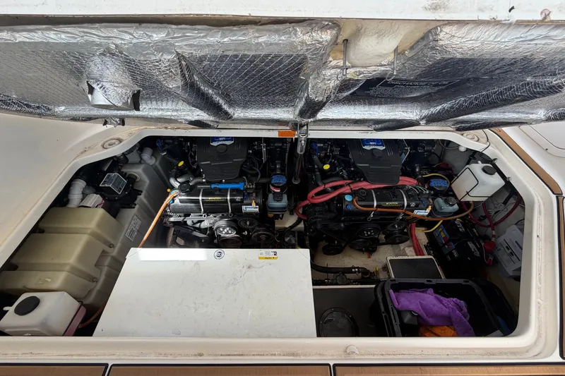 Slide: The Image of Engine compartment of a 2008 Chaparral Signature 290 boat, showcasing mechanical components. - 109