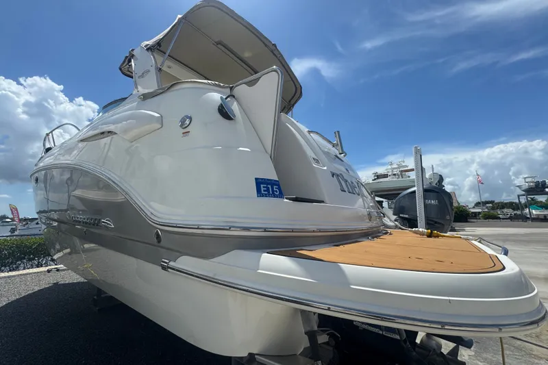 Slide: The Image of 2008 Chaparral Signature 290 boat docked under a clear blue sky. - 6
