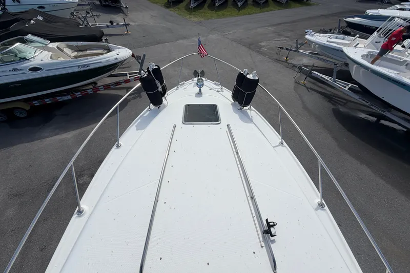 Slide: The Image of 2008 Chaparral Signature 290 boat deck view with surrounding boats in a marina. - 98