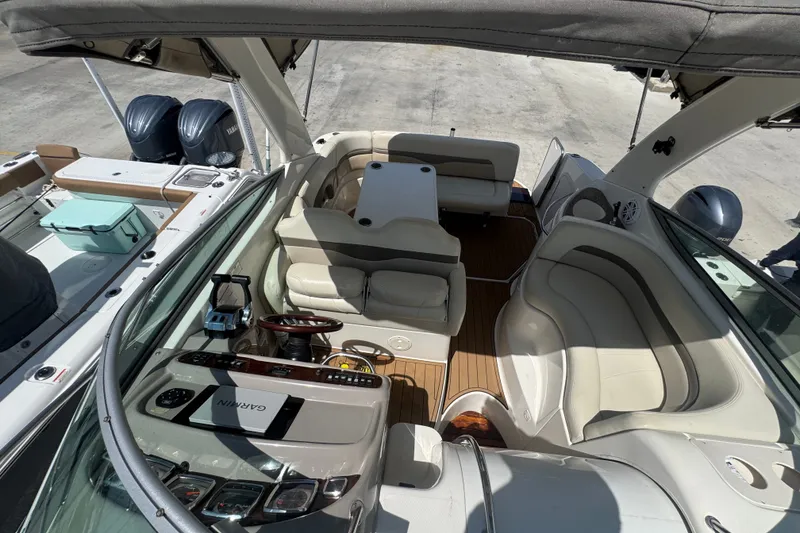 Slide: The Image of 2008 Chaparral Signature 290 boat interior with seating, steering wheel, and dashboard. - 46