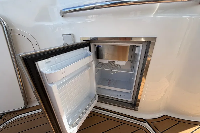 Slide: The Image of Open mini fridge on 2008 Chaparral Signature 290 boat deck. - 21
