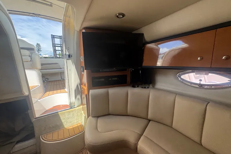 Slide: The Image of Interior of 2008 Chaparral Signature 290 yacht with seating and TV. - 34