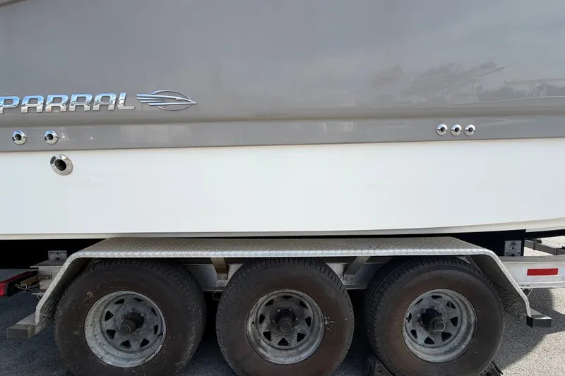 Slide: The Image of 2008 Chaparral Signature 290 boat on a triple-axle trailer, side view. - 124