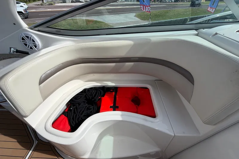Slide: The Image of 2008 Chaparral Signature 290 boat interior with storage compartment open, revealing ropes and gear. - 27