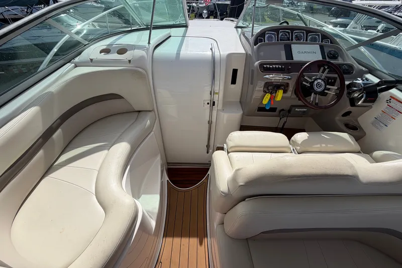 Slide: The Image of 2008 Chaparral Signature 290 boat interior with steering wheel and seating area. - 25