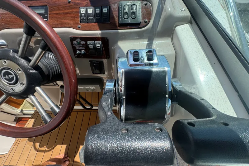 Slide: The Image of 2008 Chaparral Signature 290 boat helm with steering wheel and control panel. - 59