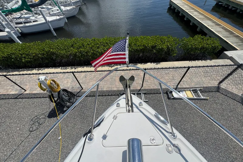 Slide: The Image of Bow view of 2008 Chaparral Signature 290 with American flag at marina. - 39