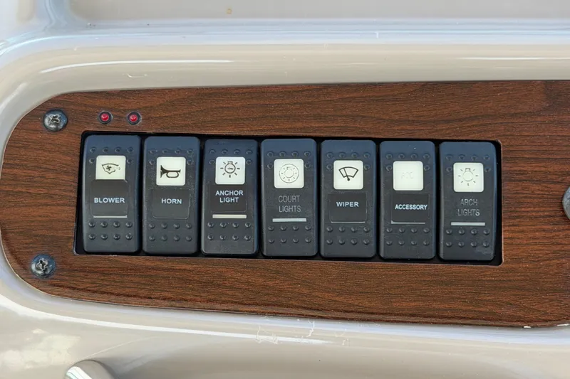 Slide: The Image of Control panel of a 2008 Chaparral Signature 290 boat with labeled switches. - 18