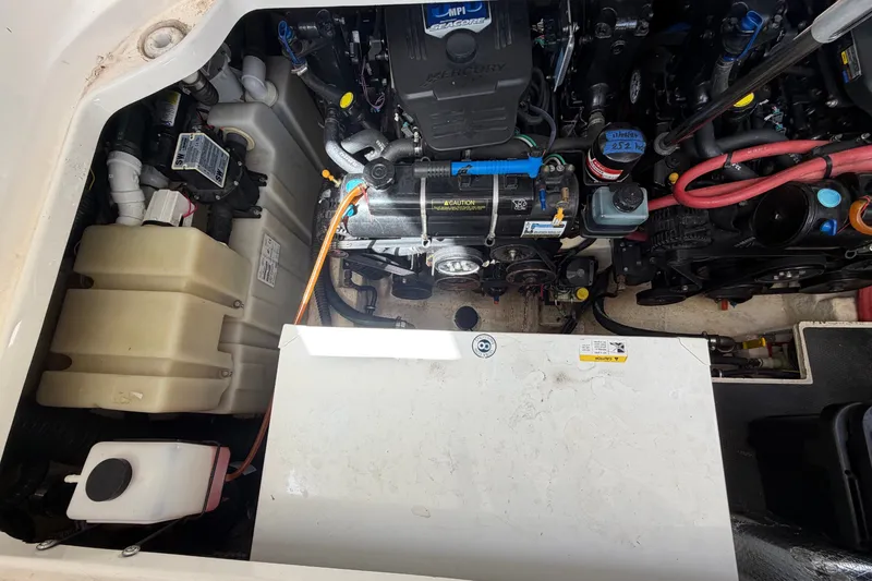 Slide: The Image of Engine compartment of a 2008 Chaparral Signature 290 boat, showcasing mechanical components. - 111