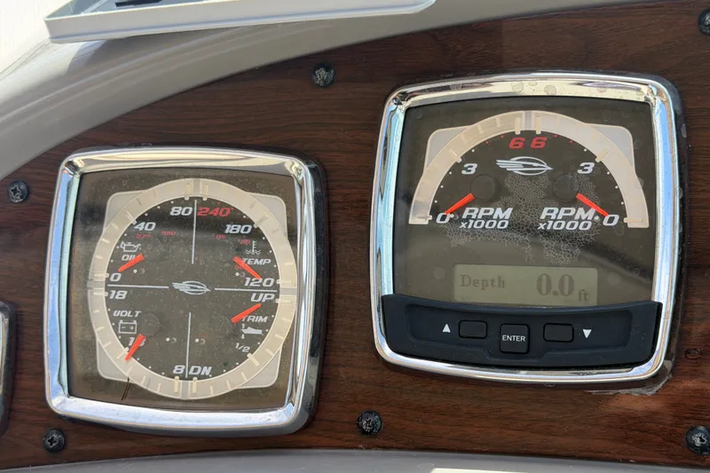 Slide: The Image of Dashboard gauges of a 2008 Chaparral Signature 290 boat, displaying RPM and engine metrics. - 32