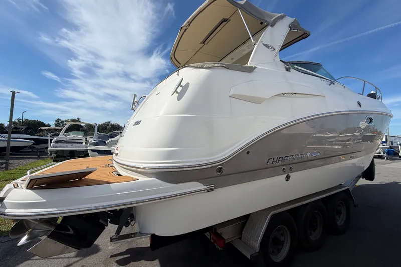 Slide: The Image of 2008 Chaparral Signature 290 boat on trailer under clear blue sky. - 6