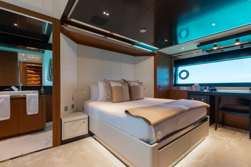 Slide: The Image of Luxurious bedroom interior on 2020 Riva 90 Argo yacht, featuring modern design and ocean view. - 32